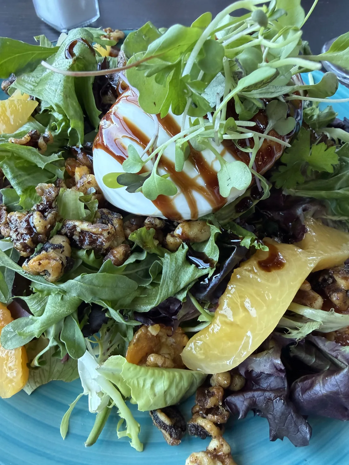 Burrata salad with greens, citrus, and balsamic at Urban Kitchen