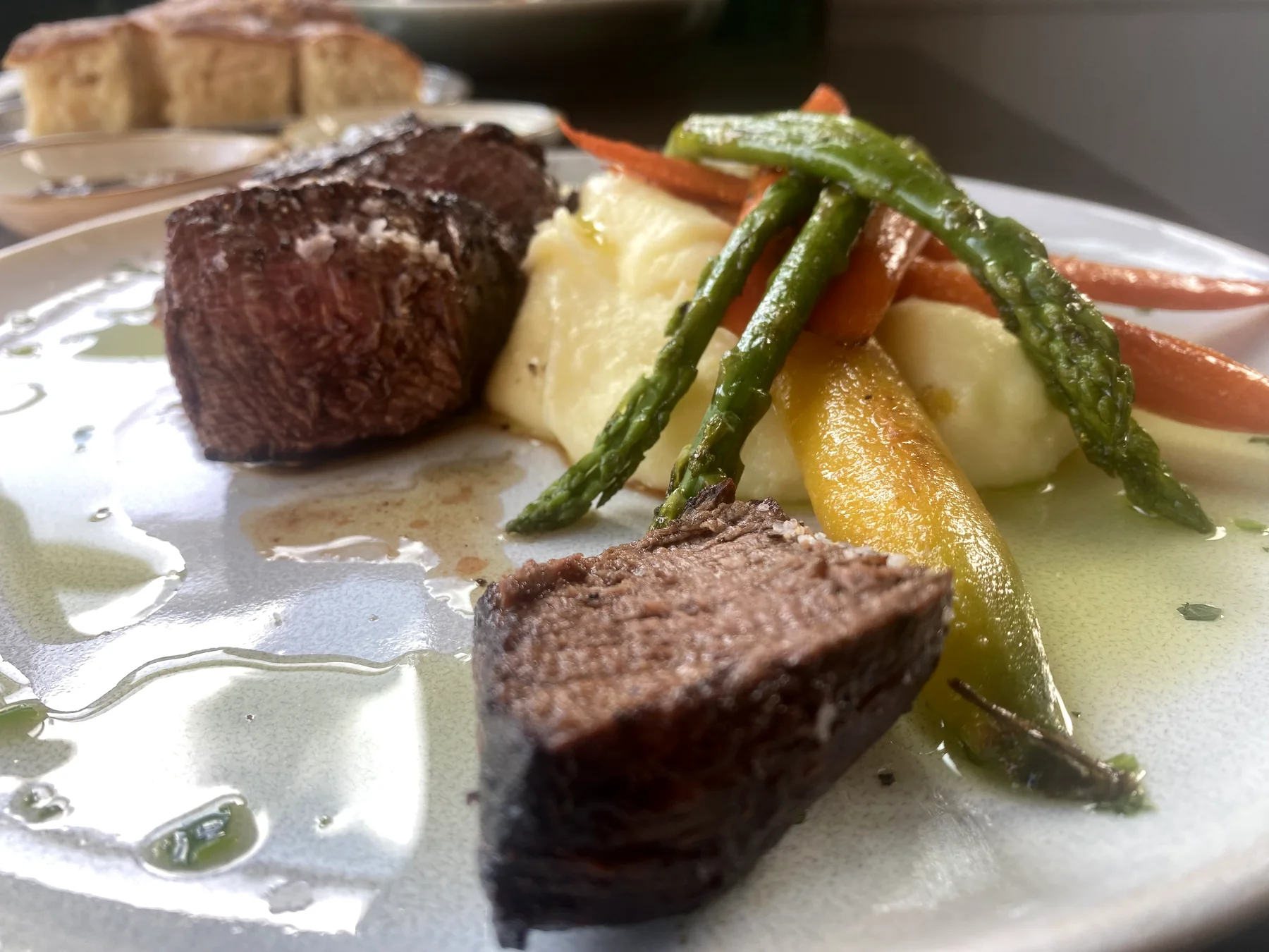 Prime filet mignon with Yukon Gold potatoes, carrots, and asparagus at Urban Kitchen
