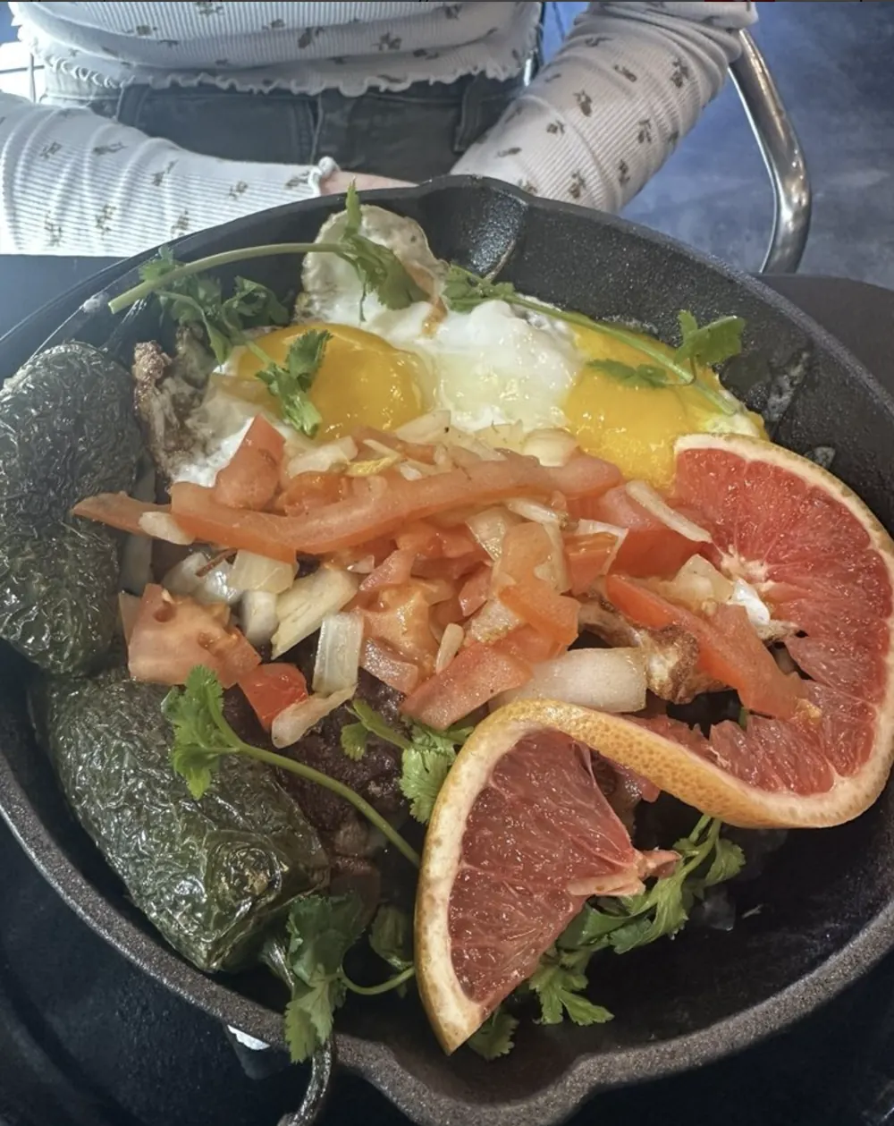 Ranchero skillet with eggs, peppers, and grapefruit
